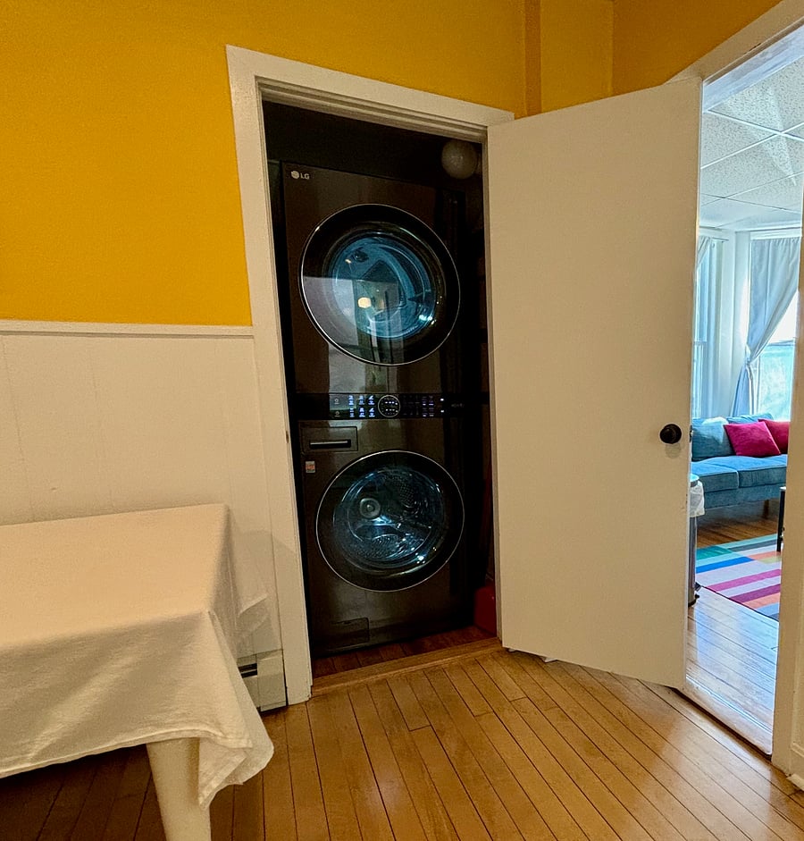 In-unit washer/dryer and entrance to living room