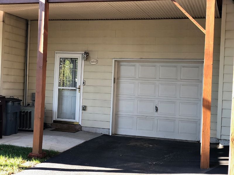 Designated off-street parking space sheltered by the 2nd story deck