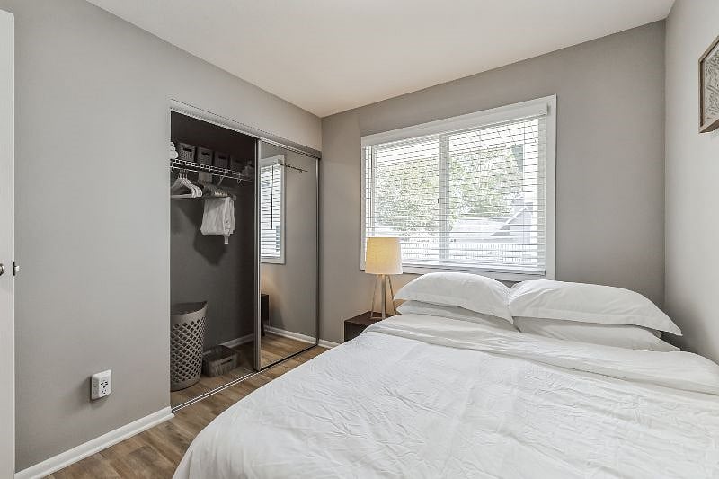 Large clean and fresh closet with organizer system and lots of hangers and baskets for all of your storage needs. USB Wall Charger Power Strip, Multi Plug Outlet.