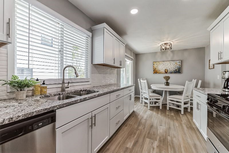 Kitchen with granite countertops and stainless-steel appliances, stocked with everything you need to feel at home.
