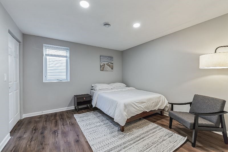 Room 6 is a large and bright room with a Queen-sized bed, large walk-in closet with organizers for all your things. Large window with faux wood blinds for sleeping! Accent chair, floor lamp for your relax and unwindings!