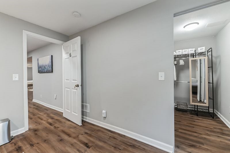 Large clean and fresh walk-in closet with organizer system and lots of hangers and baskets for all of your storage needs. USB Wall Charger Power Strip, Multi Plug Outlet.
