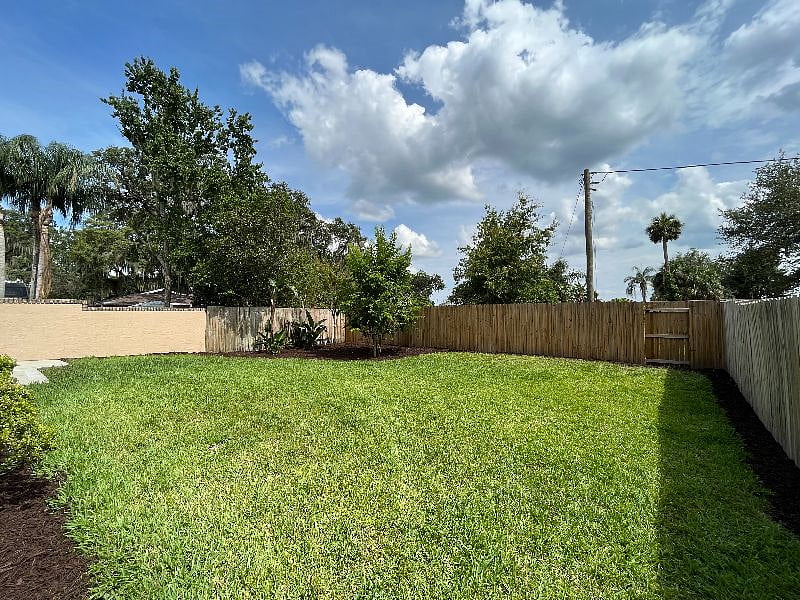 Backyard is spacious with views of Lake Dora