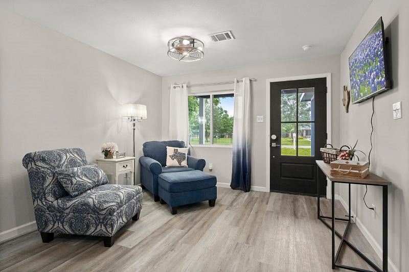 The entry room features a reading nook with comfy chairs to catch up on your favorite book, or even to watch some tv.