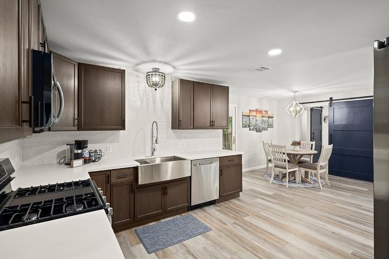 The open kitchen leads to the breakfast nook which seats 4 comfortably.