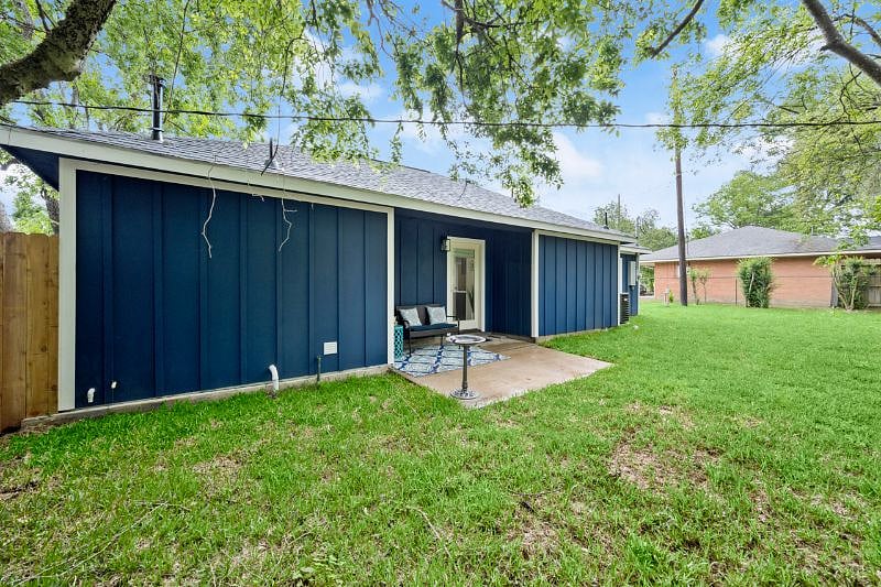 Nice size backyard that is fully fenced and has nice shade trees.