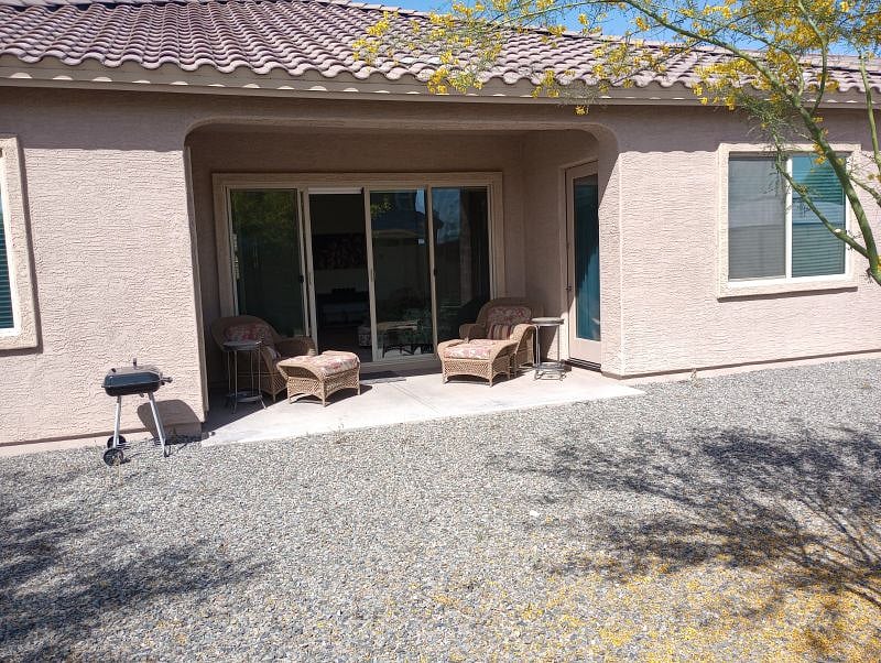 Backyard patio with small grill