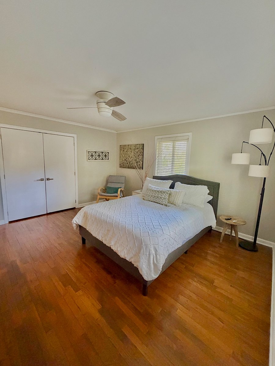 Large main room with a large closet and a queen bed.