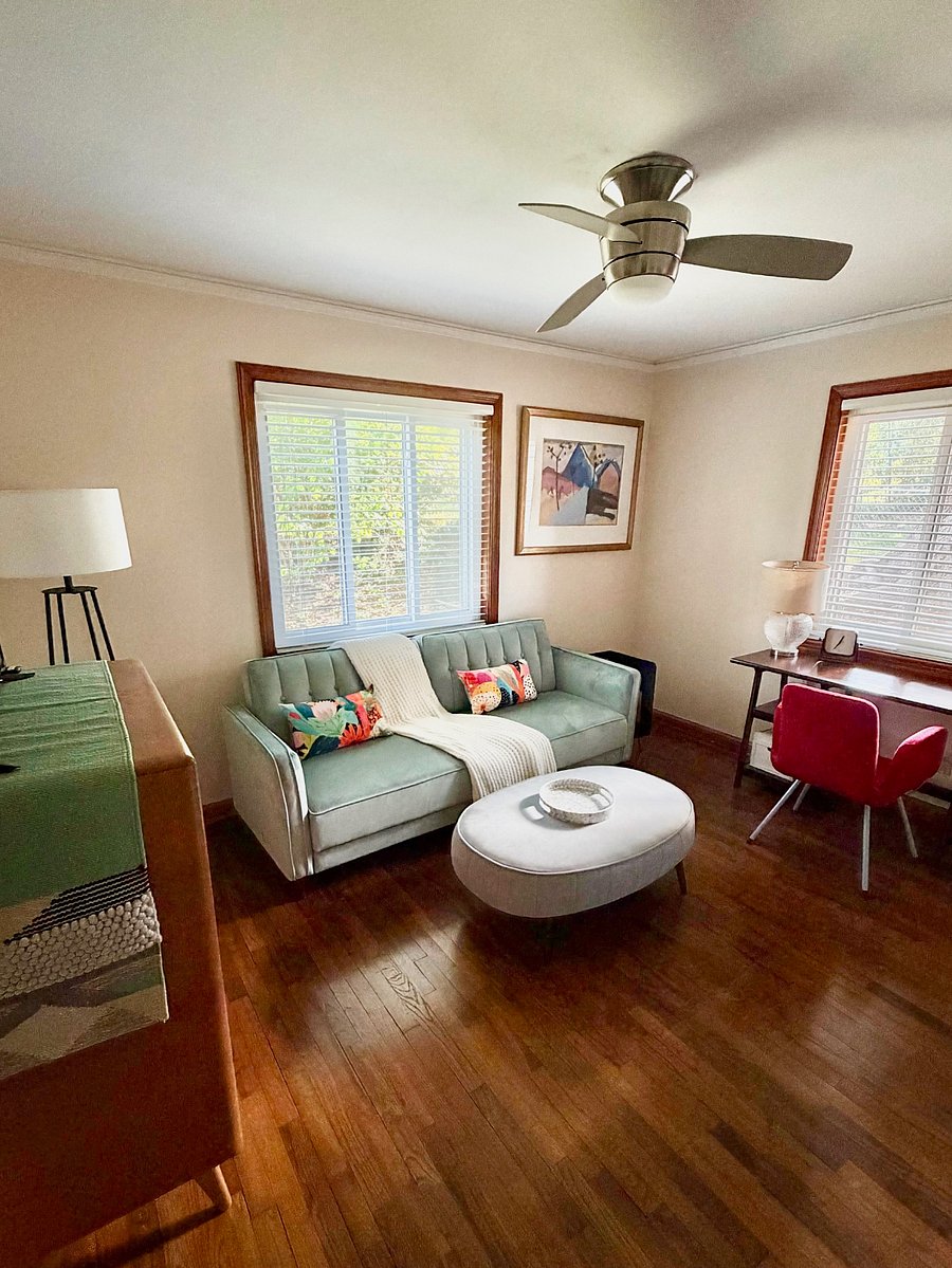 Office/ flex room with tv, desk and couch that turns into a double bed