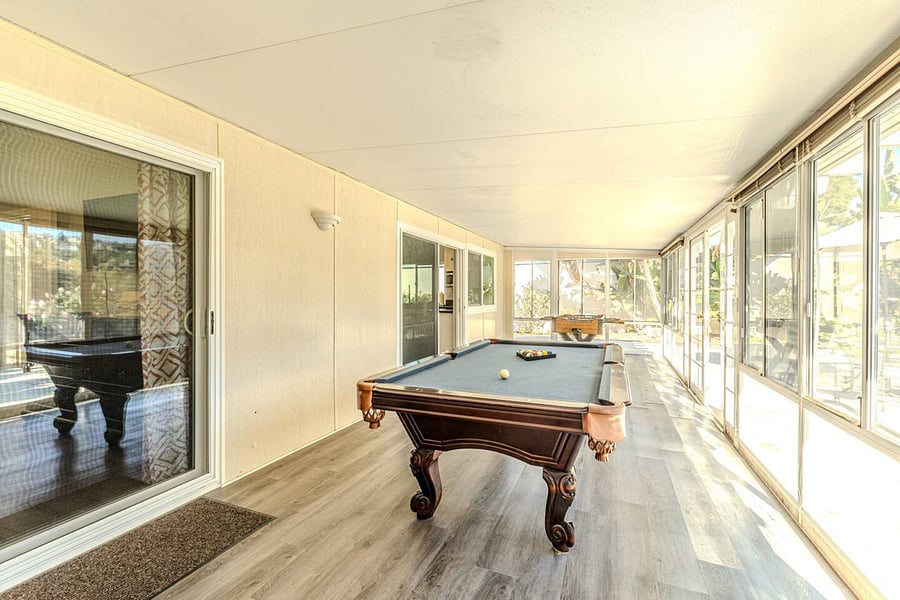 Unwind together with a pool table and foosball, offering the ultimate family game experience.