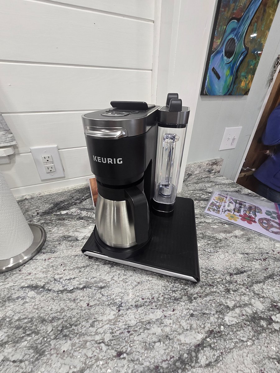Keurig Duo Plus coffee maker. Uses K-cups and brews a full pot of ground coffee.