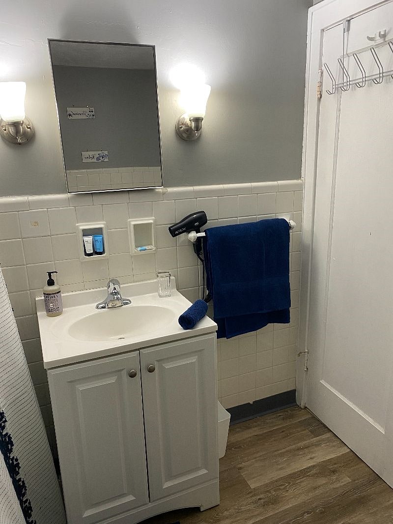 Bathroom with basic essentials and towels