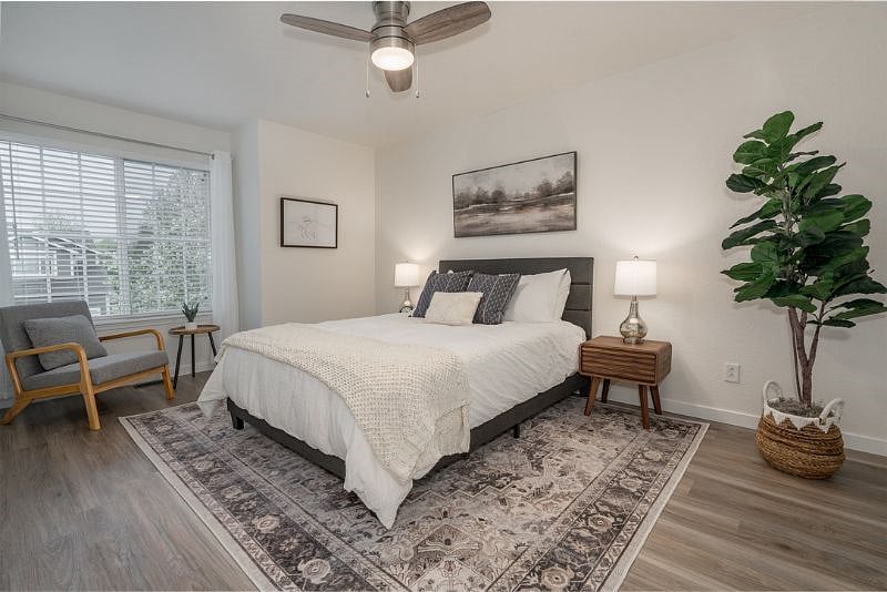 Retreat to the Master Bedroom with a comfortable QUEEN bed and a cozy seating area for moments of relaxation. 