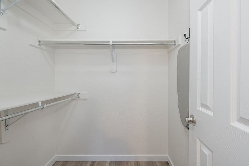 Discover the ultimate convenience in our spacious MASTER walk-in closet. 