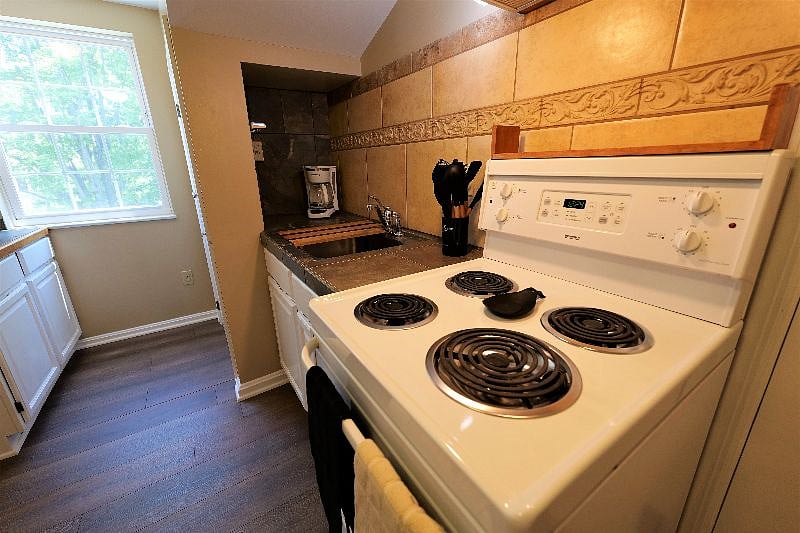 Kitchen Area - stove, cabinets (lots of storage space!), utensils, coffee maker and more are already in stock!