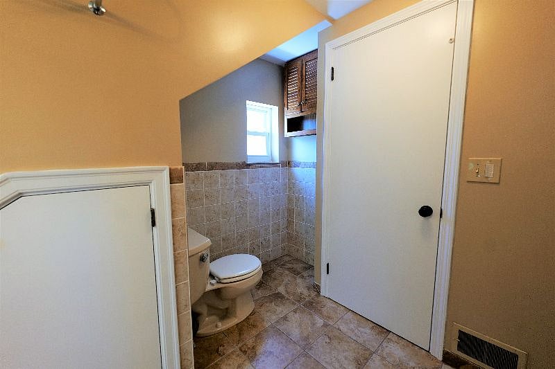 Full bathroom - view from sink looking towards toilet.