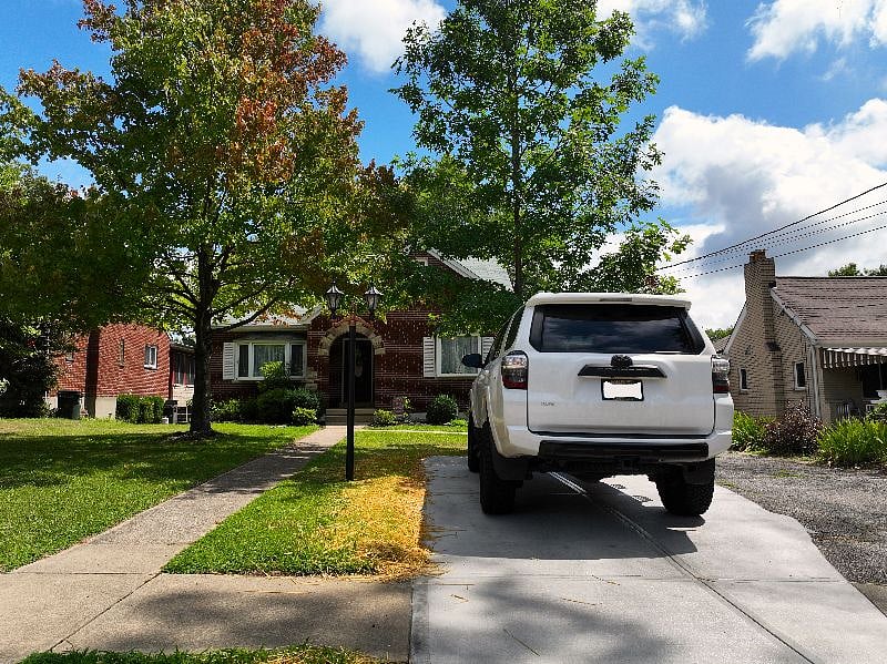 Guest has their own parking spot a short distance from their entrance. Owners utilize the back portion of the property to park and enter the home.