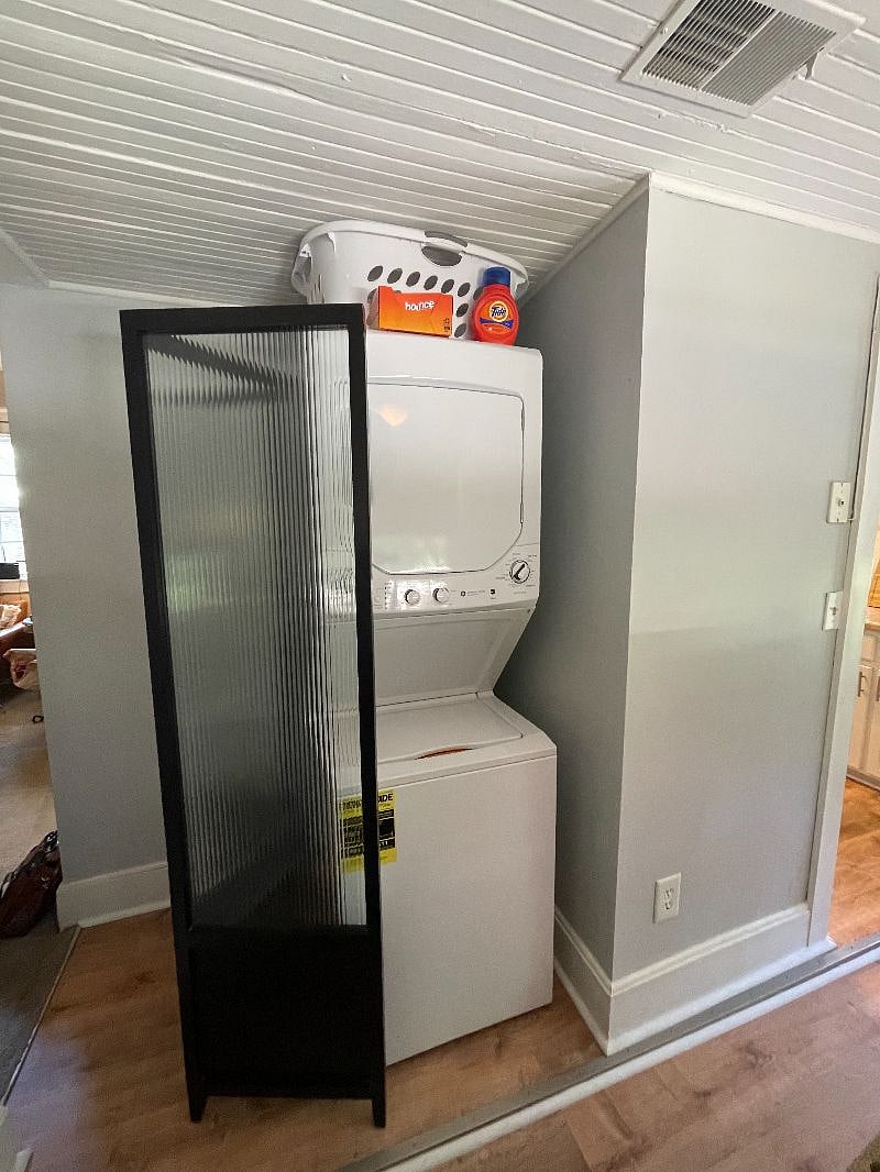 Newer washer/dryer unit, conveniently located in hallway between dining and den area