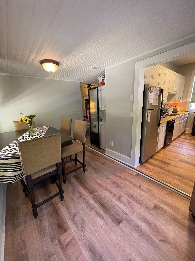 New flooring and a spacious pub-style table complete the dining area. Off of the dining area, you'll find a private deck for morning coffee or enjoying the outdoors.