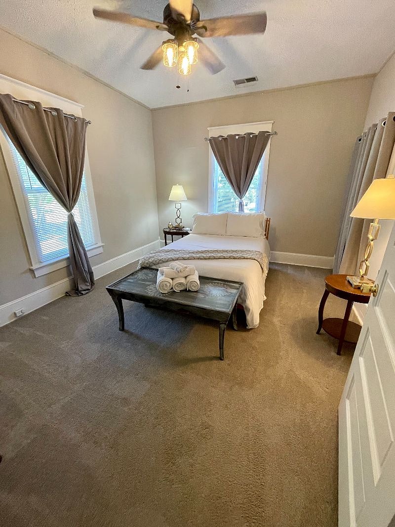 Second large bedroom, with new bedding and mattress, luxury linens, closet space, high ceilings, and plenty of room.
