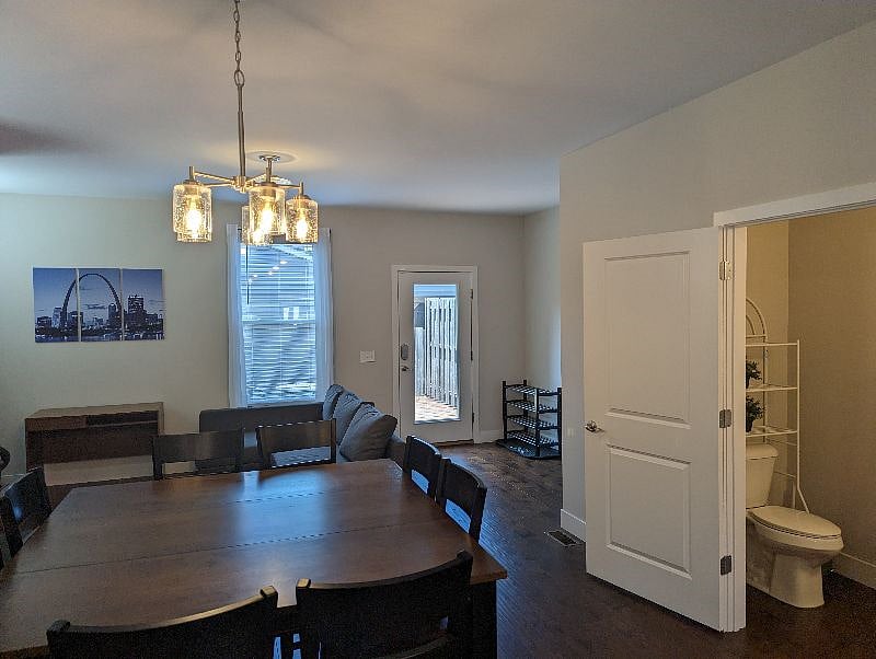 Dining room, second living room, and half bathroom