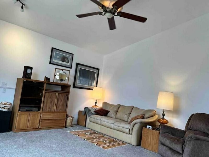 Living room with vaulted ceiling, gas fireplace and south facing large windows.  Comfortable leather furniture and smart TV