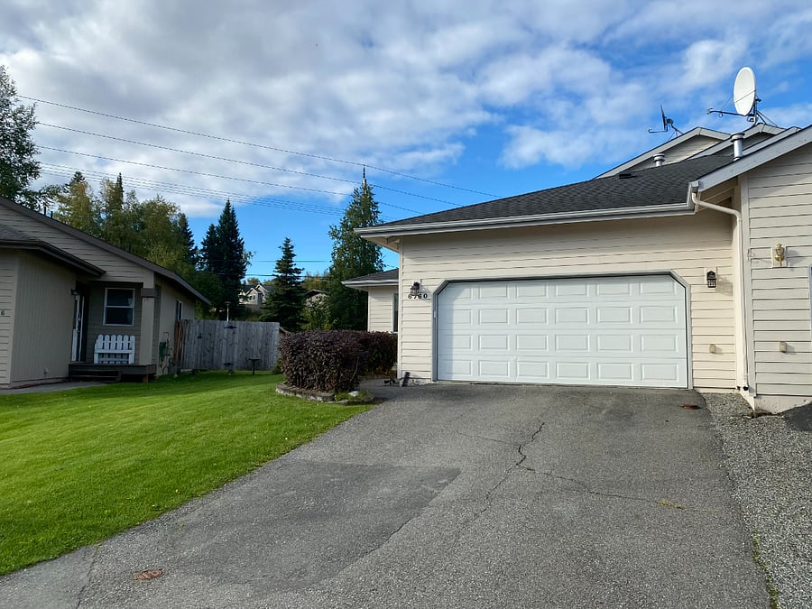 Two car garage and large drive way for ample parking.