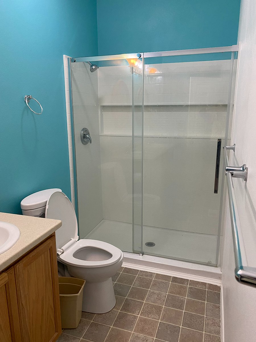 Master ensuite bathroom with walk-in shower, double sinks, and Jacuzzi tub