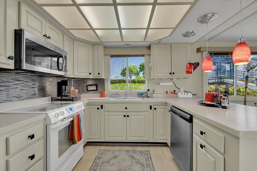 Full kitchen with dishwasher, range cooktop, and oven