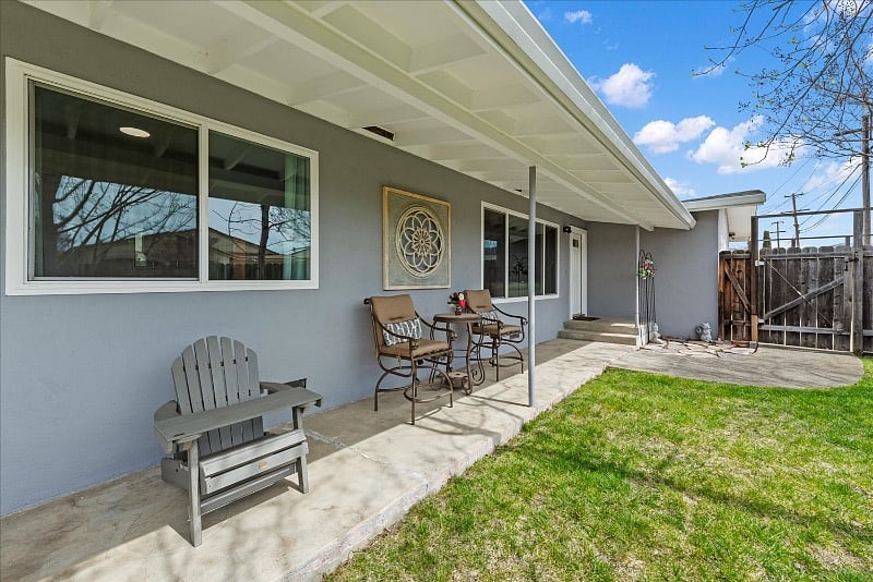 Patio near the entrance with outdoor table and chairs