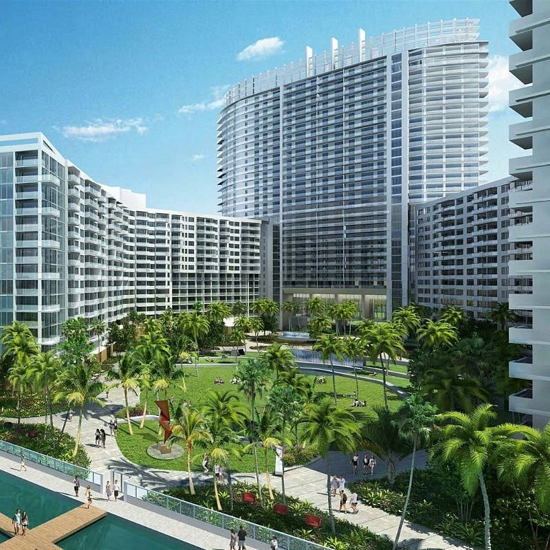 courtyard with dog parks, seating, salon, dry cleaner, market, med spa, and more. Exit leads directly to bay water.