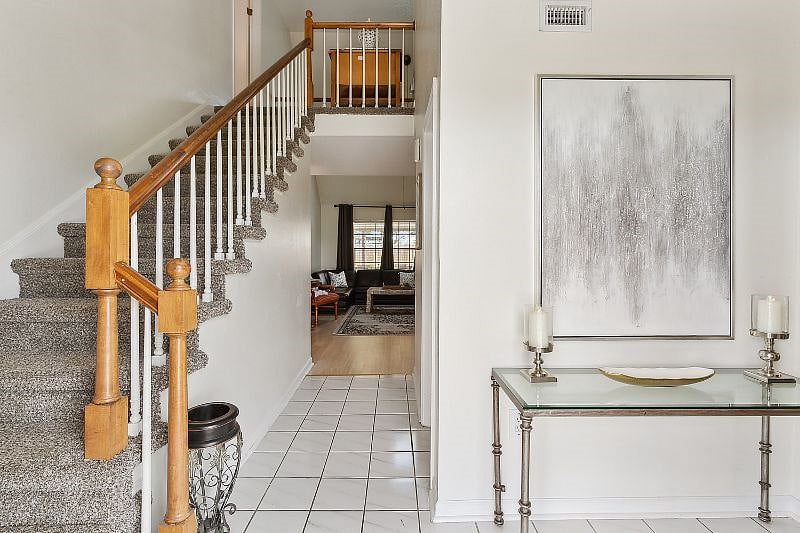 Front door entryway with a guest 1/2 bath to your right