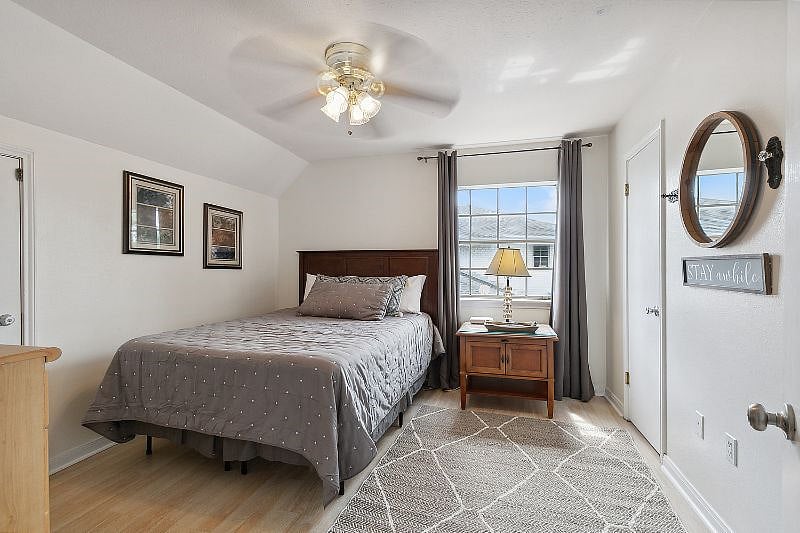 Upstairs bedroom with queen bed, tv blackout curtains and adjoining full bathroom two large walls in closets!