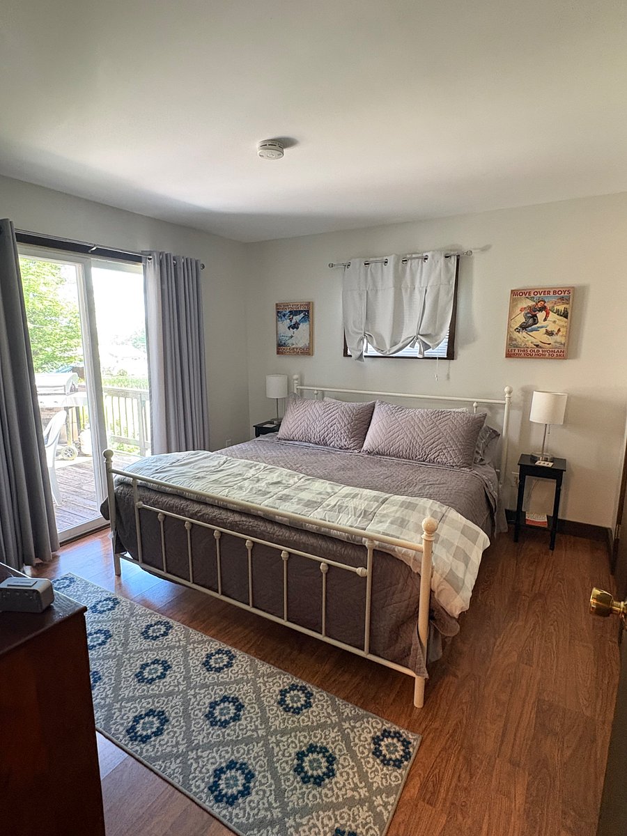 Primary Bedroom large closet and dresser with deck off slider.
