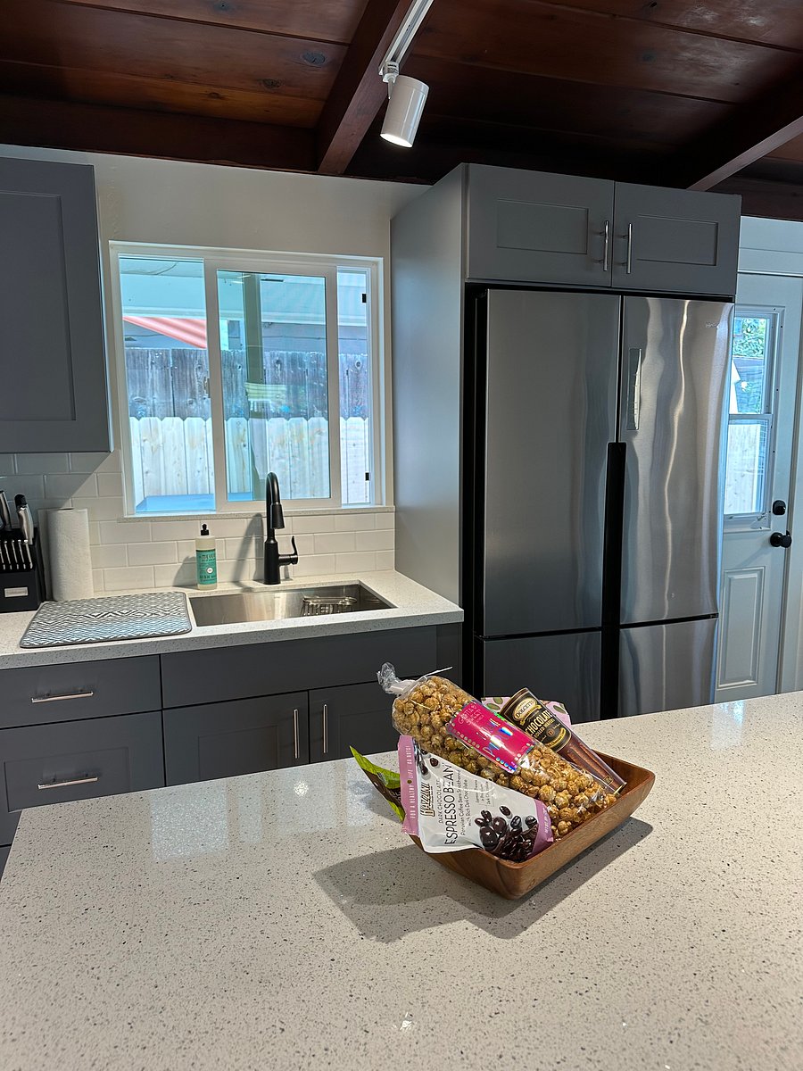 Kitchen sink looks out onto the patio/BBQ and eating area.
