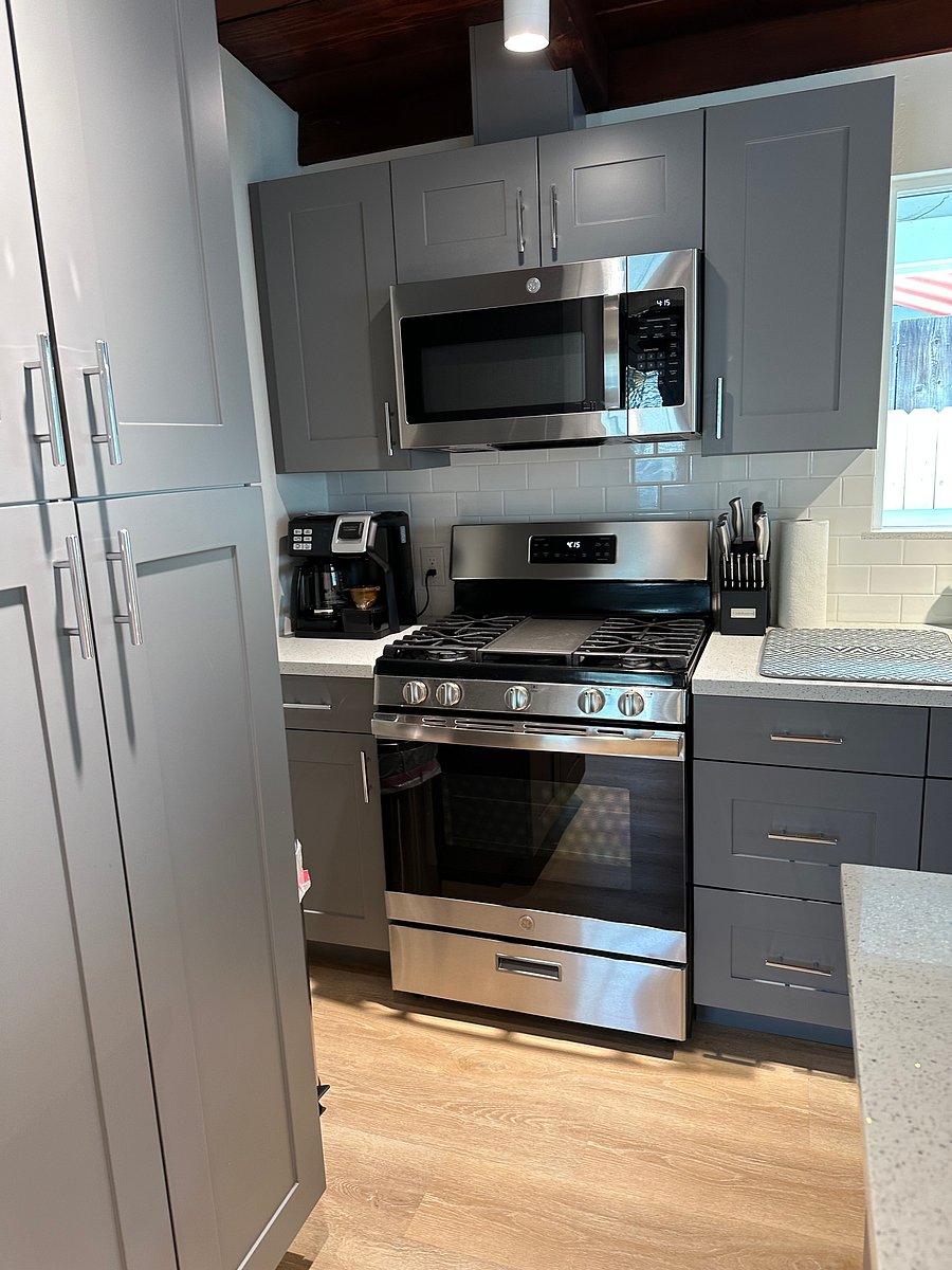 Kitchen has all conveniences ready for cooking, full appliances include: Stove, oven, refrigerator, microwave. Plenty of food storage with a roomy pantry cabinet.