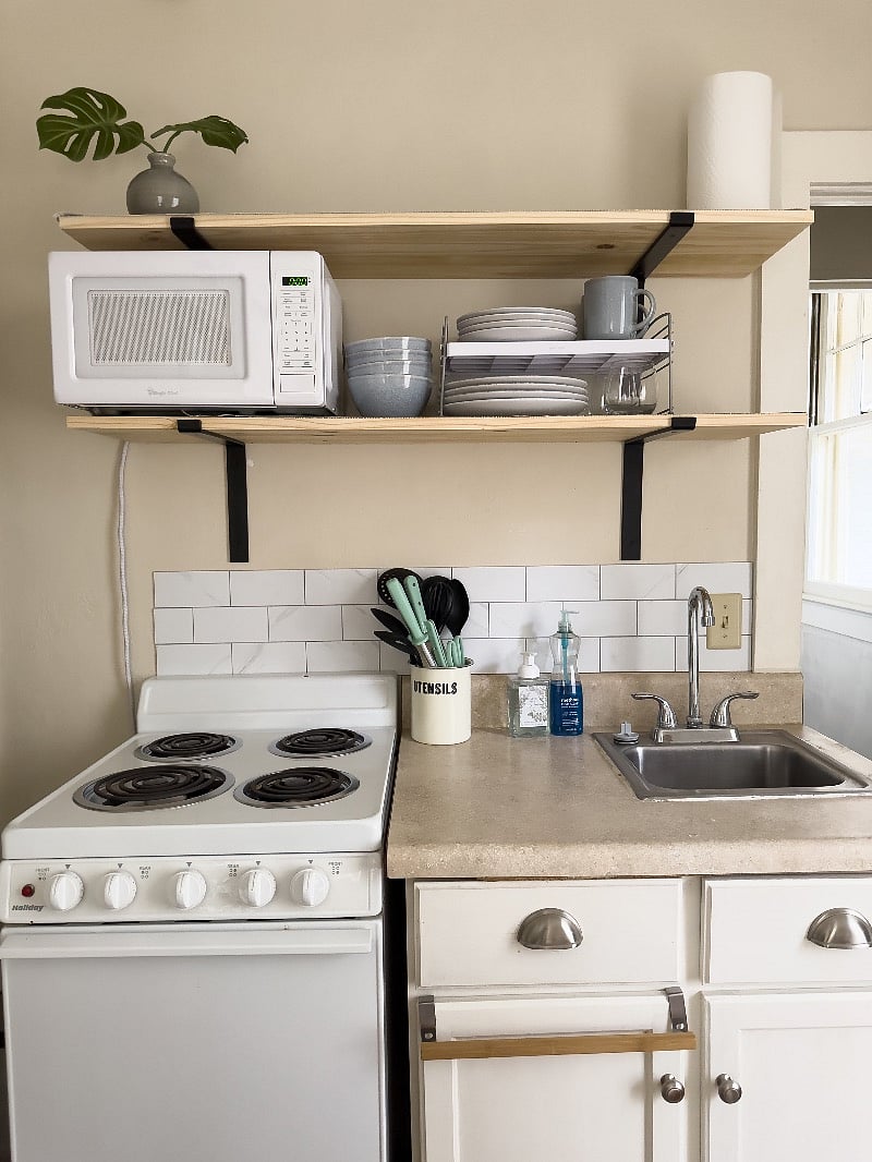 Kitchenette with medium size cooktop and oven, sink is on the small side.