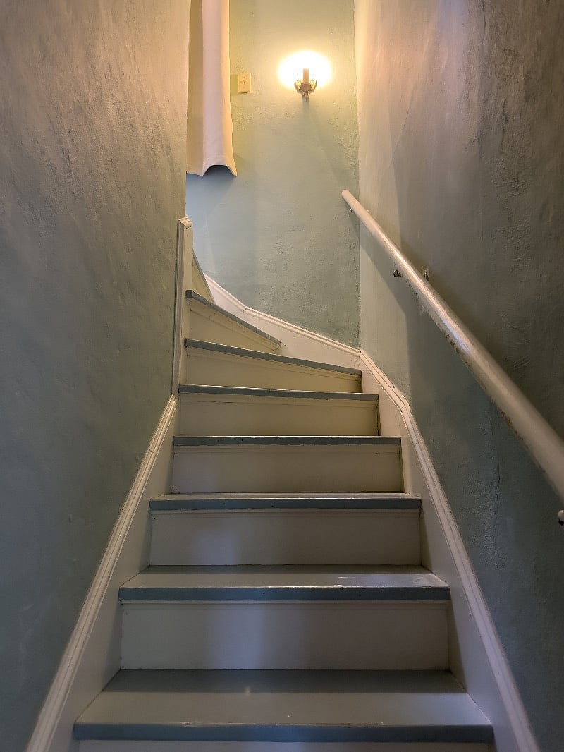 Stairs to bedroom. The ceiling on the stair hallway is low if you are tall. 