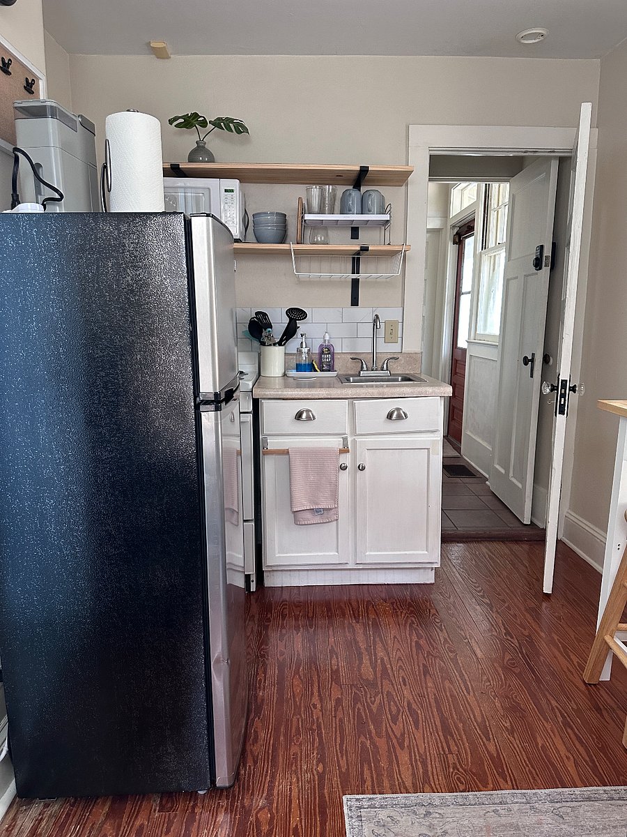 Kitchenette with 4 burner cooktop with oven. 7.5 cu ft refrigerator
