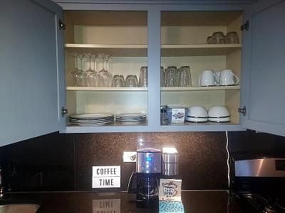 Upper cabinet featuring glassware.