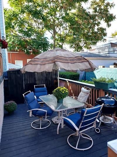 Rear patio with grille on right.