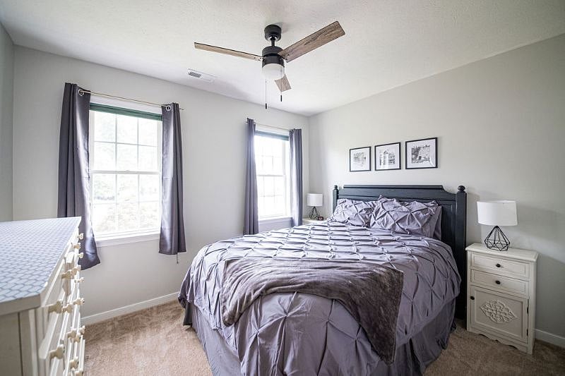 Bedroom 2 - Guest Bed with hybrid queen mattress, standard closet, blackout curtains and ceiling fan.
