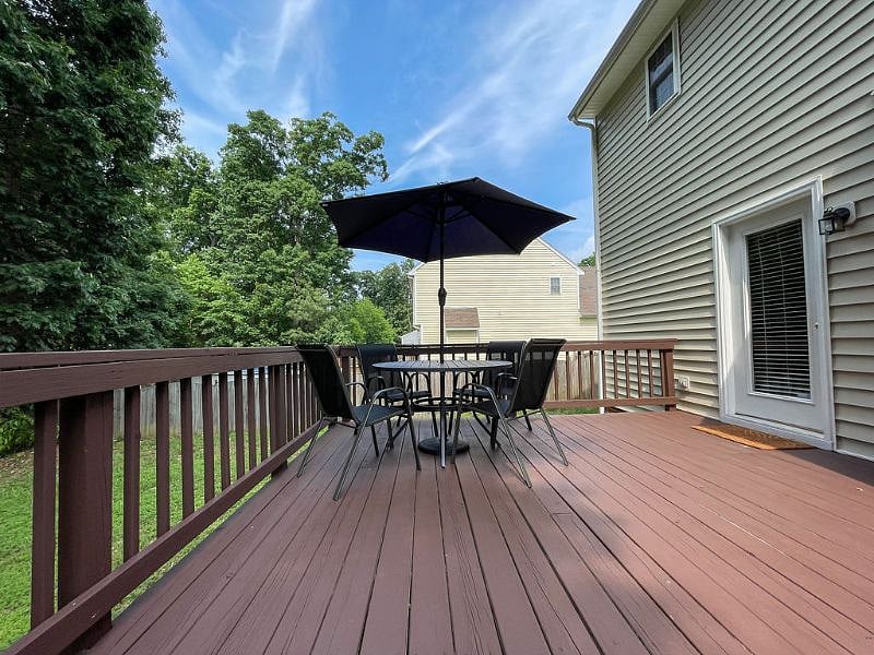 Large back deck and private fenced-in backyard.