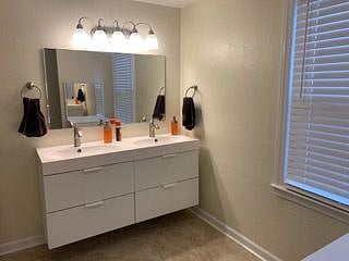 Large main bathroom on main level with vanity.
