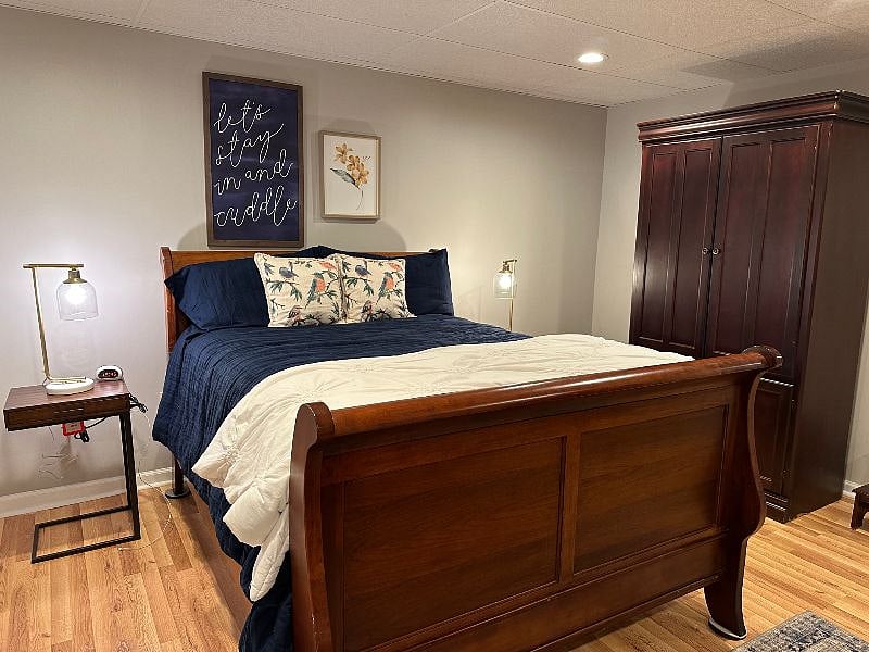 LEFT SIDE OF ROOM INCLUDING BED AND WARDROBE FOR HANGING THOSE QUICK ITEMS THAT MAY BE NEEDED QUICKLY OR FOR GUEST TO HANG THEIR ITEMS UP!