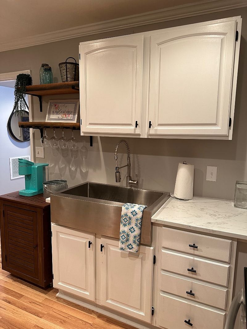 NEW WALNUT WINE GLASS SUSPENDED SHELVES! NEW KEURIG COFFEE MAKER AND BAR! CABINETS UP AND DOWN IN THE KITCHEN AREA! NEW COUNTRY-STYLE SINK AND FAUCETS WITH BUILT-IN SPRAYER!