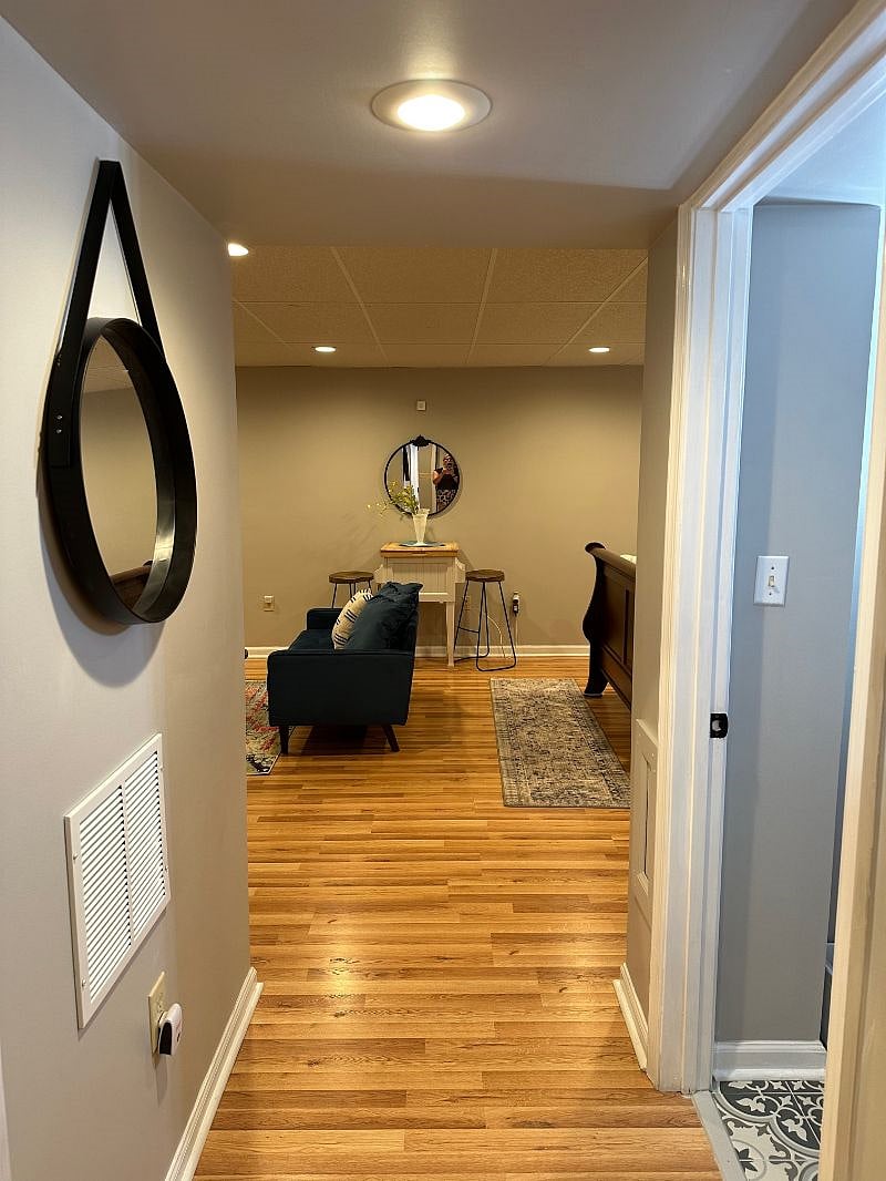 HALLWAY COMING INTO LIVING ROOM/BEDROOM COMBINATION! ALL NEW SHEETROCK, PAINT, MOLDINGS AND CASINGS!