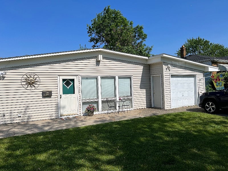 Private entrance, garage and driveway