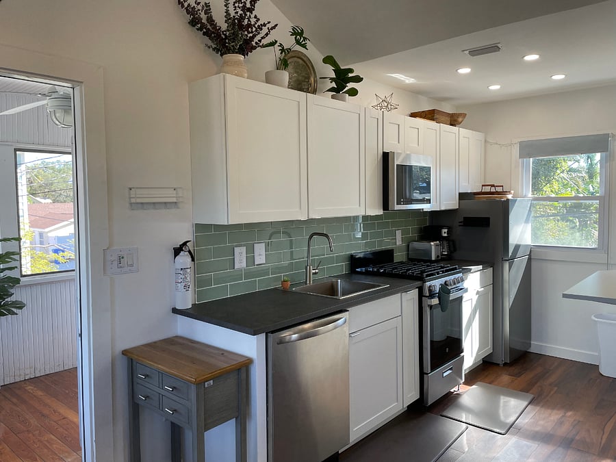 Kitchen with door to screened in porch
