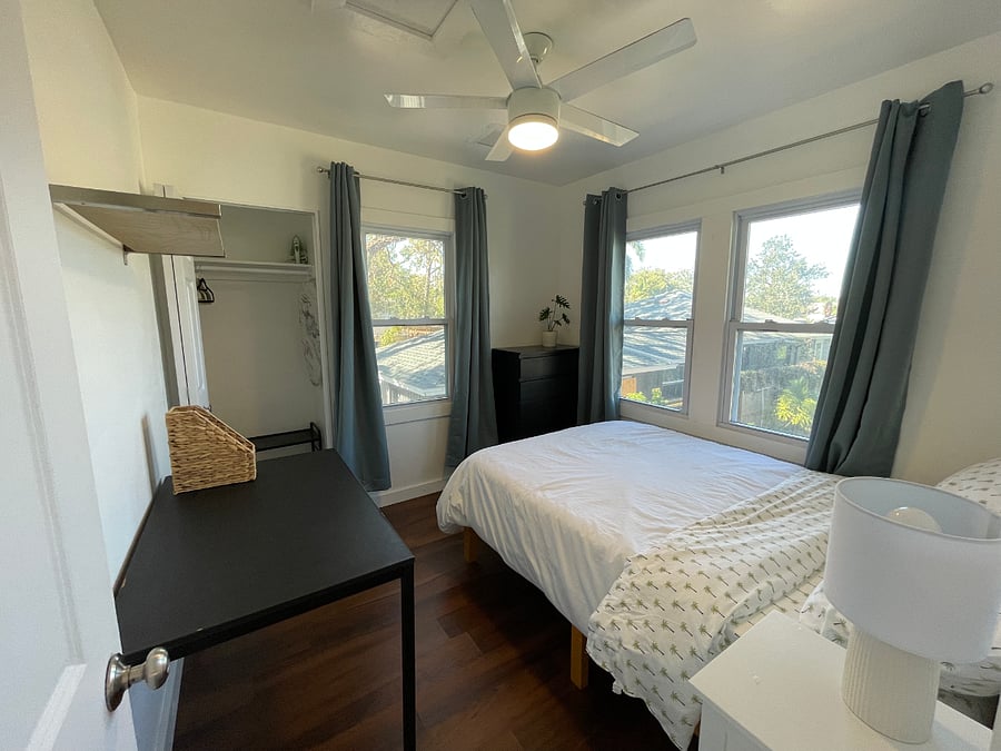 Northside bedroom with full sized bed, rollaway storage under bed